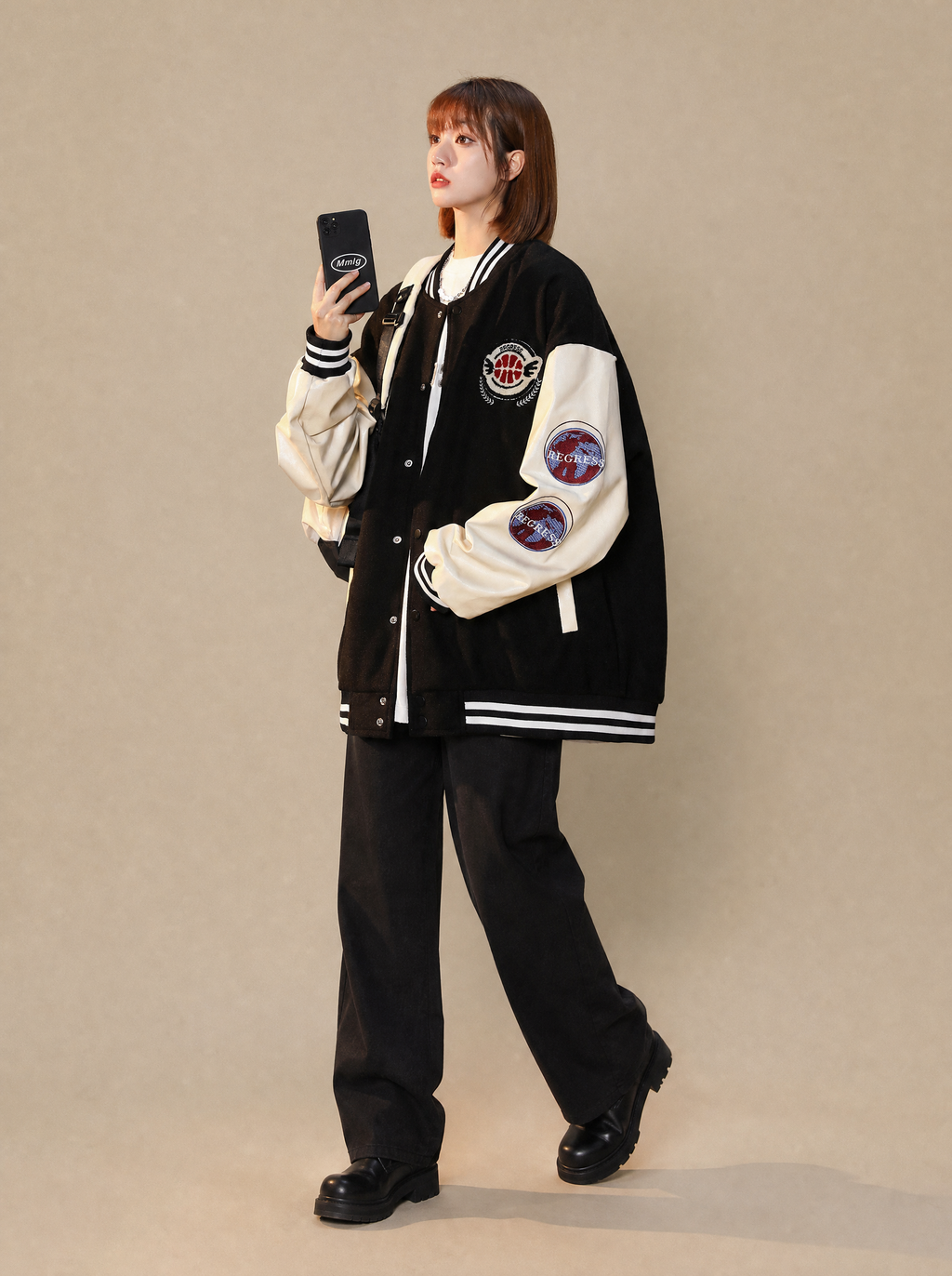 Worn by a Japanese female model: Women's Regress Varsity Jacket
