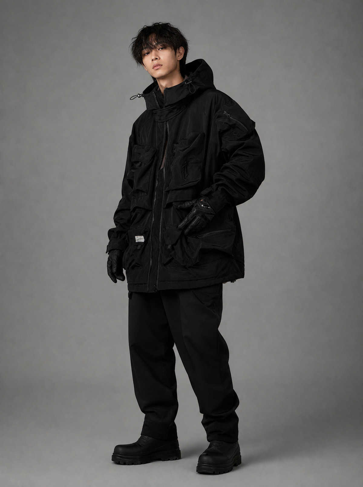 Worn by a Japanese male model: HiJ25 Black Storage X Tech Jacket
