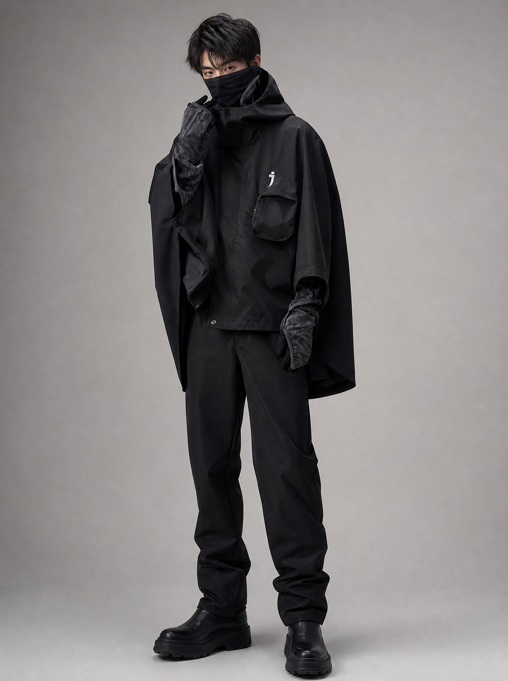 Worn by a Japanese male model: HiJ40 Black I-Tech Poncho